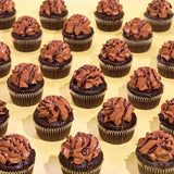 Vegan Chocolate Cupcakes by Crumbs & Doilies with rich chocolate sponge, plant-based buttercream, and chocolate drizzle.